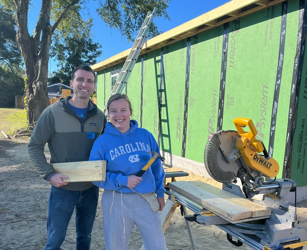 Two Ohanafy team members at a community home build