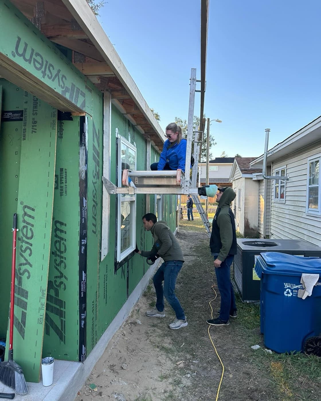 The team framing and building a home together