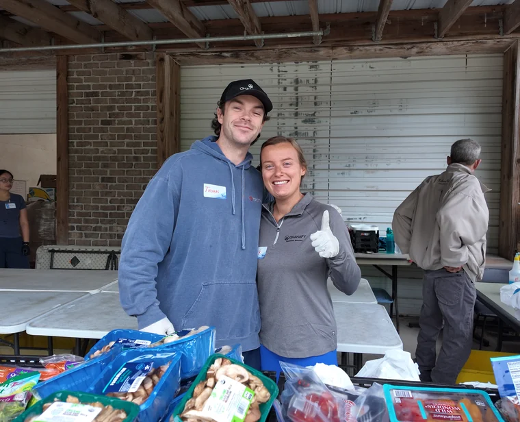 Two team members at a community house build
