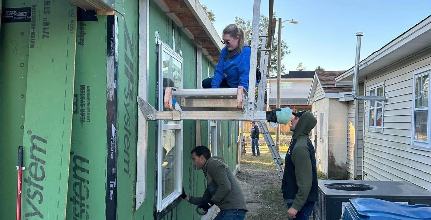 The team framing and building a home together
